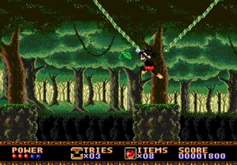 Mickey safely swinging on a vine while farming points in Castle of Illusion Mickey Mouse swinging on a vine in Castle of Illusion